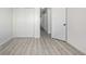 Bright bedroom with gray flooring and double door closet at 2538 S Dover Way, Lakewood, CO 80227