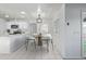 Cozy dining area with a round table, modern chairs, and bright natural lighting at 2538 S Dover Way, Lakewood, CO 80227