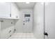 Laundry room with built-in cabinets and exterior access at 2538 S Dover Way, Lakewood, CO 80227