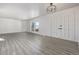 Bright living room with hardwood floors and double doors at 2538 S Dover Way, Lakewood, CO 80227