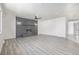 Spacious living room featuring a fireplace and wood-look floors at 2538 S Dover Way, Lakewood, CO 80227