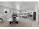 Bright primary bedroom with neutral tones, modern furniture, and natural light from large windows at 2538 S Dover Way, Lakewood, CO 80227