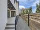 Private backyard with gravel pathway and wooden fence at 521 Milwaukee St, Denver, CO 80206