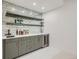 Stylish basement bar with gray cabinets and wine cooler at 521 Milwaukee St, Denver, CO 80206