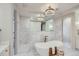 Spa-like bathroom featuring a soaking tub and marble tile at 521 Milwaukee St, Denver, CO 80206