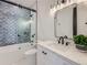 Modern bathroom with a tub, shower, and stylish vanity at 521 Milwaukee St, Denver, CO 80206