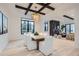 Open concept dining area with a statement chandelier and modern wooden dining table at 521 Milwaukee St, Denver, CO 80206