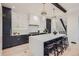 Modern kitchen with two-toned cabinetry and a large quartz island at 521 Milwaukee St, Denver, CO 80206