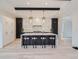 Spacious kitchen featuring a large island, white and dark cabinetry, and hardwood floors at 521 Milwaukee St, Denver, CO 80206