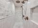 Large walk-in shower with double shower heads and marble tile at 521 Milwaukee St, Denver, CO 80206