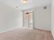 Bright, spacious bedroom with neutral carpet and a sliding door provides ample natural light at 4100 Albion St # 614, Denver, CO 80216