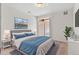 Well-lit main bedroom with queen size bed, large window, and modern decor at 4100 Albion St # 614, Denver, CO 80216