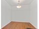 Empty dining area with hardwood floors and contemporary lighting at 4100 Albion St # 614, Denver, CO 80216