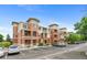Inviting exterior of a multi-unit building with manicured landscaping and ample parking spaces at 4100 Albion St # 614, Denver, CO 80216
