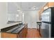 Kitchen features stainless steel appliances, double sink, and granite countertops at 4100 Albion St # 614, Denver, CO 80216