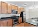 Well-equipped kitchen features stainless steel appliances, granite countertops and wood cabinets at 4100 Albion St # 614, Denver, CO 80216