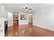 Hardwood floors highlight this open living room with a fireplace and access to the kitchen at 4100 Albion St # 614, Denver, CO 80216