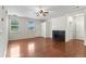 Inviting living room featuring hardwood floors, fireplace, and natural light streaming through windows at 4100 Albion St # 614, Denver, CO 80216