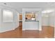 Bright living room offering a seamless transition to the kitchen with hardwood floors and natural light at 4100 Albion St # 614, Denver, CO 80216