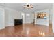 Bright living room with hardwood floors, a fireplace and open access to the kitchen and dining at 4100 Albion St # 614, Denver, CO 80216