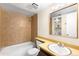 The bathroom features a tub-shower combination, a vanity with a sink and a large mirror at 3041 S Ursula Cir # 302, Aurora, CO 80014