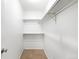 A walk-in closet with a carpeted floor and adjustable shelving for organized storage at 3041 S Ursula Cir # 302, Aurora, CO 80014