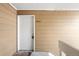 Condo entrance featuring unit number 302 with a white door and beige siding at 3041 S Ursula Cir # 302, Aurora, CO 80014