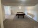 Spacious basement featuring neutral carpeting and a pool table ready for entertaining at 11237 W 55Th Ln, Arvada, CO 80002