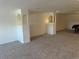 A finished basement area with built-in display columns and neutral-toned carpeting at 11237 W 55Th Ln, Arvada, CO 80002
