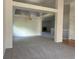 Spacious living room featuring neutral carpet, white walls, and a chandelier at 11237 W 55Th Ln, Arvada, CO 80002