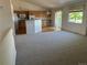 Open floor plan showcasing the living room and bright kitchen with an eat-in island at 11237 W 55Th Ln, Arvada, CO 80002