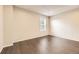 Bright bedroom with ample natural light and dark wood flooring at 8243 S Fillmore Cir, Centennial, CO 80122