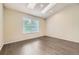 Bright bedroom with ample natural light, skylights, and dark wood flooring at 8243 S Fillmore Cir, Centennial, CO 80122