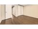 Bedroom with ample natural light, closet, and dark wood flooring at 8243 S Fillmore Cir, Centennial, CO 80122