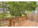 Inviting wood deck, with a staircase leading down to a lower level, offers outdoor enjoyment at 8243 S Fillmore Cir, Centennial, CO 80122