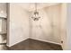 Charming dining room with dark wood floors and modern pendant lighting at 8243 S Fillmore Cir, Centennial, CO 80122