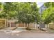 Charming row of townhomes with mature trees, garages, and well-maintained exteriors at 8243 S Fillmore Cir, Centennial, CO 80122