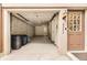 Attached one-car garage with interior access door, adjacent to the front door of this townhouse at 8243 S Fillmore Cir, Centennial, CO 80122