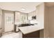 Open kitchen design with stainless steel appliances, quartz countertops, and access to the exterior at 8243 S Fillmore Cir, Centennial, CO 80122