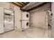 Basement laundry area with stacked washer and dryer units at 8243 S Fillmore Cir, Centennial, CO 80122
