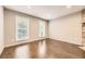 Bright living room with hardwood floors, neutral walls, and large windows, perfect for relaxation at 8243 S Fillmore Cir, Centennial, CO 80122
