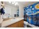 Bathroom featuring a vanity with modern fixtures and a shower at 14828 E 118Th Pl, Commerce City, CO 80603