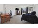 Bedroom featuring a desk, a dresser, a window and a comfy looking bed at 14828 E 118Th Pl, Commerce City, CO 80603