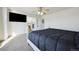 Main bedroom features a ceiling fan, and doorway leading into ensuite bathroom at 14828 E 118Th Pl, Commerce City, CO 80603