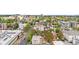 A scenic aerial view showing the property nestled in a vibrant urban setting with green trees at 624 E 18Th Ave # 4, Denver, CO 80203