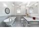 Elegant bathroom features a clawfoot tub, marble countertop, and stylish fixtures at 624 E 18Th Ave # 4, Denver, CO 80203