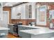 Charming kitchen with white quartz counters, stainless steel appliances, and decorative lighting at 624 E 18Th Ave # 4, Denver, CO 80203