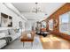Bright open-concept living space boasts exposed brick, hardwood floors, and modern decor at 624 E 18Th Ave # 4, Denver, CO 80203