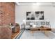 Cozy living room features stylish seating, hardwood floors, and a large abstract art piece at 624 E 18Th Ave # 4, Denver, CO 80203