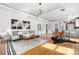 Modern open-concept living area with stylish furniture, hardwood floors, and plenty of sunlight at 624 E 18Th Ave # 4, Denver, CO 80203